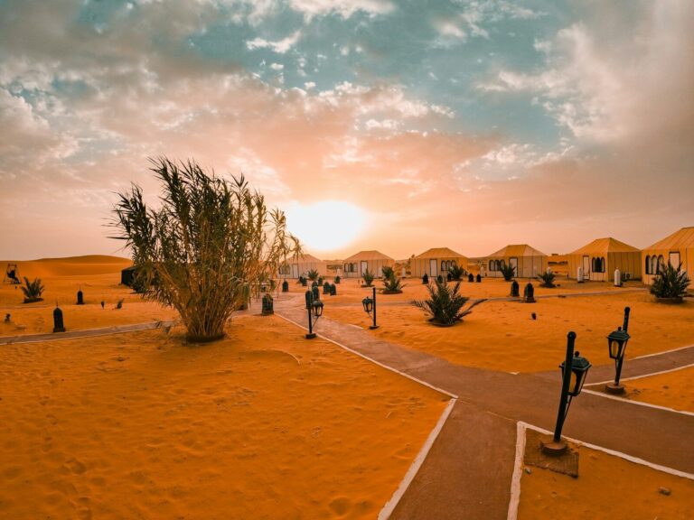 Desert camp at sunset with tents and tents